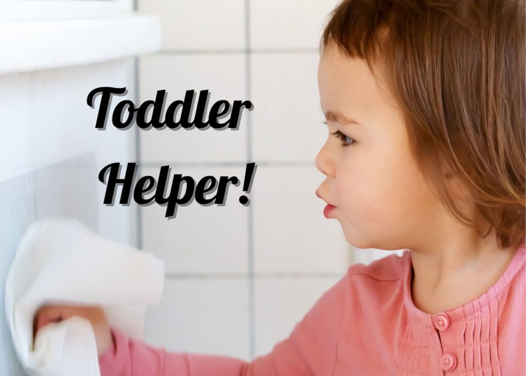 Toddler helping mom clean